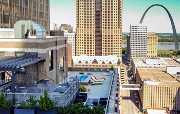 an aerial view of a pool and the arch in the city of saint louis
